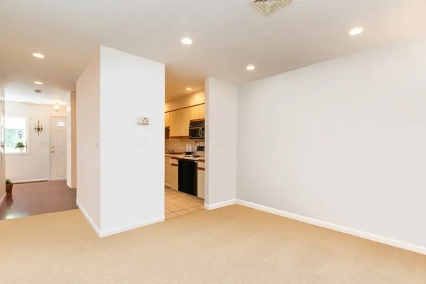 a view of a kitchen with a refrigerator