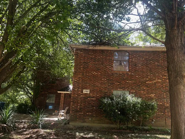 a view of house with yard