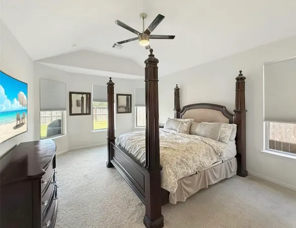 a bedroom with bed and window