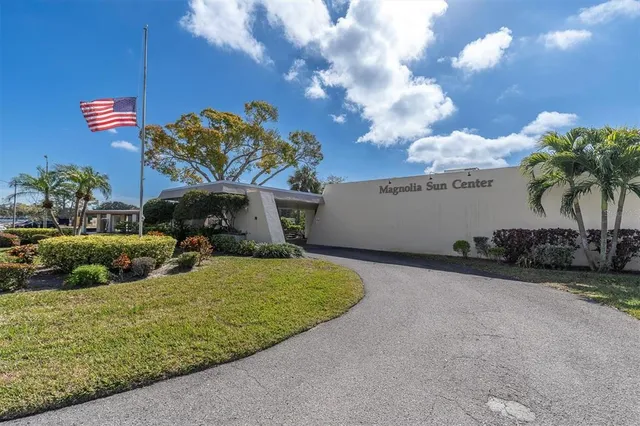 a view of a house with a yard and a garage