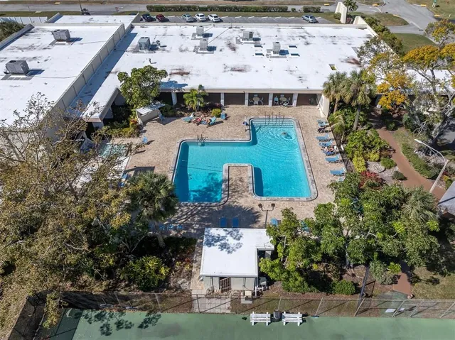 an aerial view of house with yard swimming pool and outdoor seating