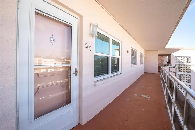 a view of a hallway with windows