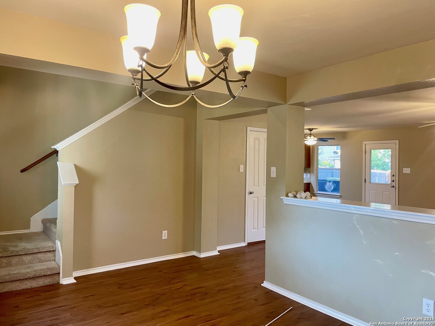 145 Pinto Place Cibolo, TX 78108 - Photo 15 of 32 a view of a room with wooden floor and staircase