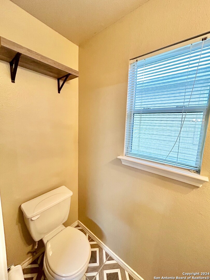 145 Pinto Place Cibolo, TX 78108 - Photo 22 of 32 a white toilet sitting next to a window