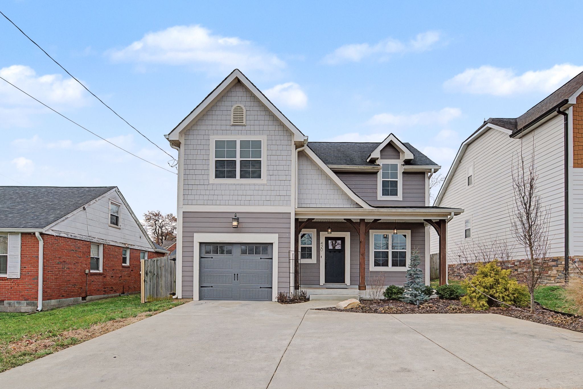 420 Anderson Lane Madison, TN 37115 - Photo 1 of 28 a front view of a house with a yard and garage