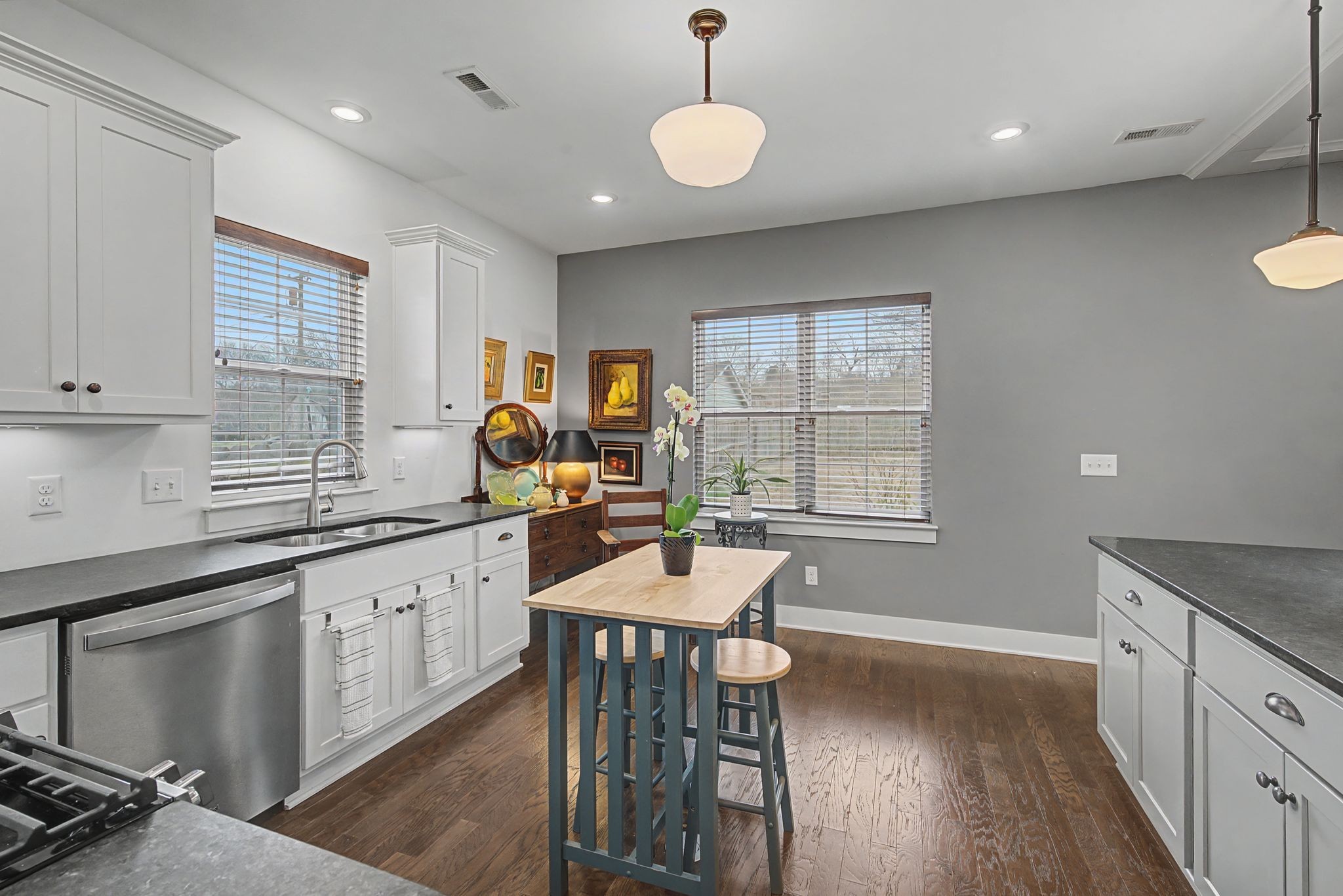420 Anderson Lane Madison, TN 37115 - Photo 11 of 28 a kitchen with granite countertop a stove a sink a dining table and chairs