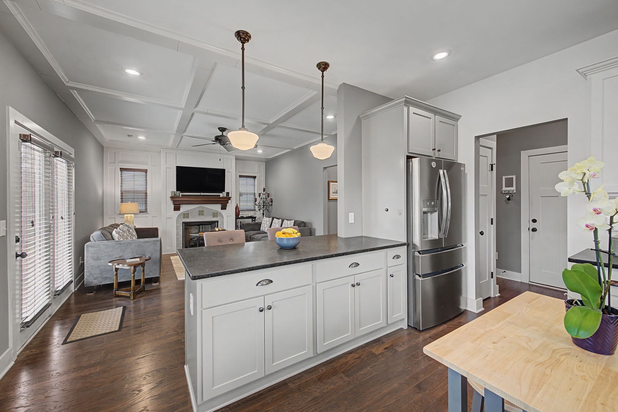 420 Anderson Lane Madison, TN 37115 - Photo 12 of 28 a kitchen with stainless steel appliances kitchen island granite countertop a refrigerator a stove a sink dishwasher and white cabinets with wooden floor