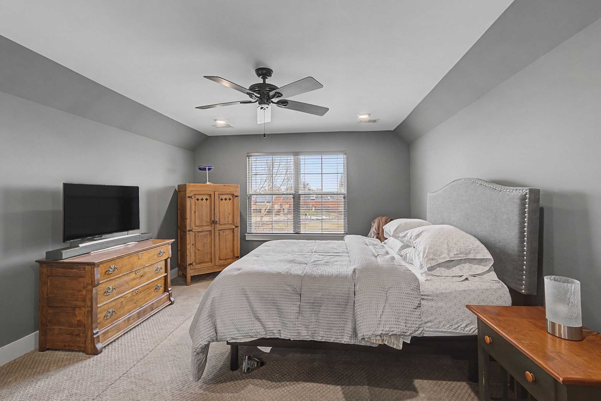 420 Anderson Lane Madison, TN 37115 - Photo 20 of 28 a bedroom with a bed and a flat screen tv