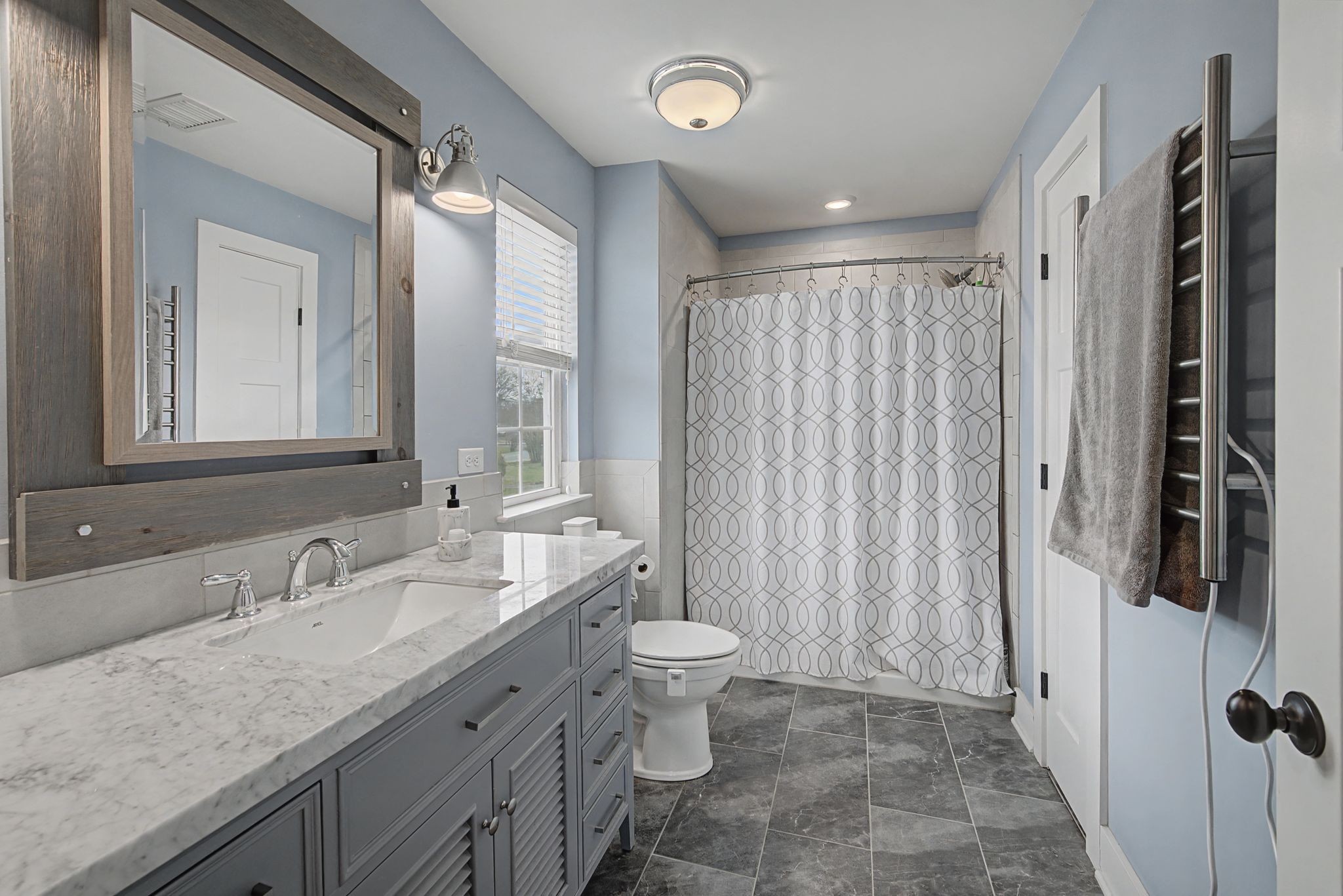 420 Anderson Lane Madison, TN 37115 - Photo 22 of 28 a bathroom with a granite countertop sink toilet and shower