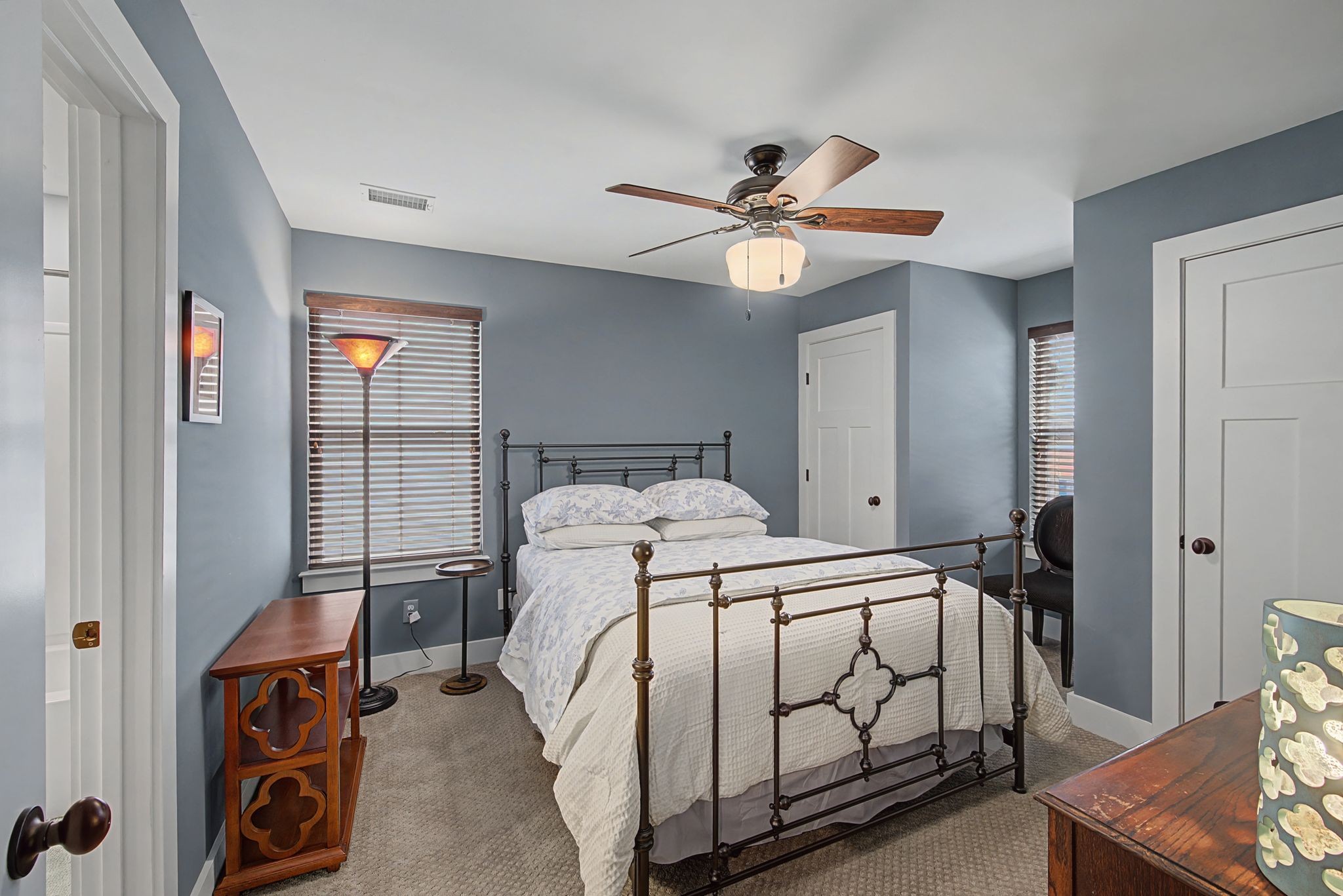 420 Anderson Lane Madison, TN 37115 - Photo 23 of 28 a bedroom with a bed and a chandelier