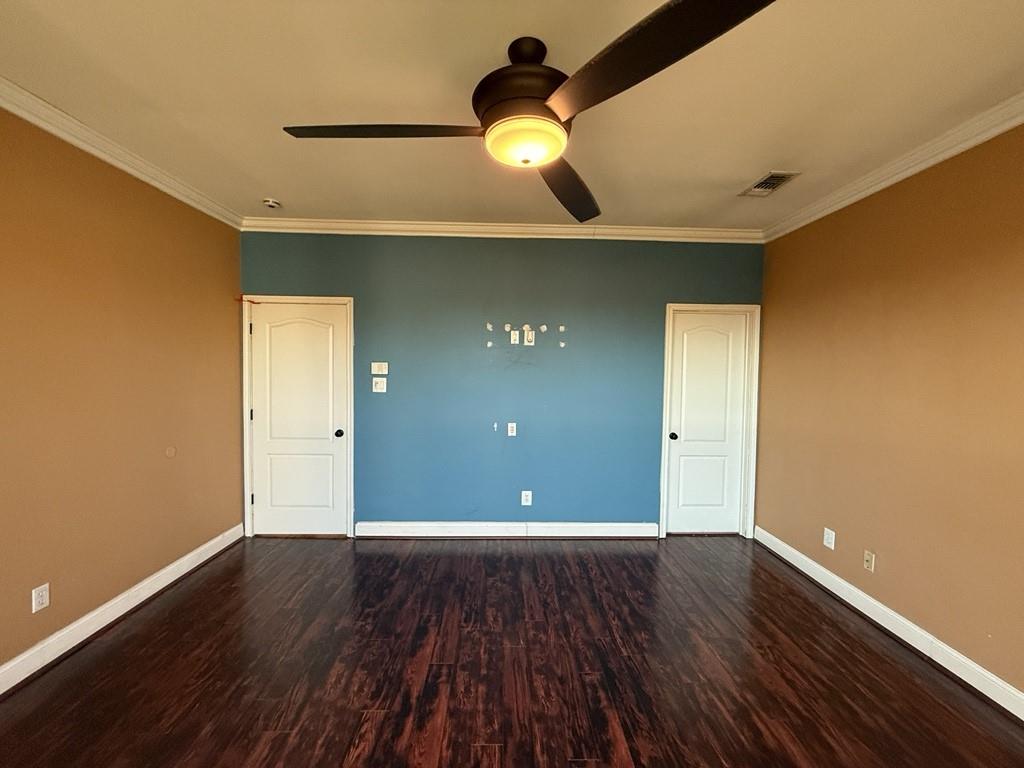 117 Hanover Street Grand Prairie, TX 75052 - Photo 15 of 40 a view of an empty room with wooden floor