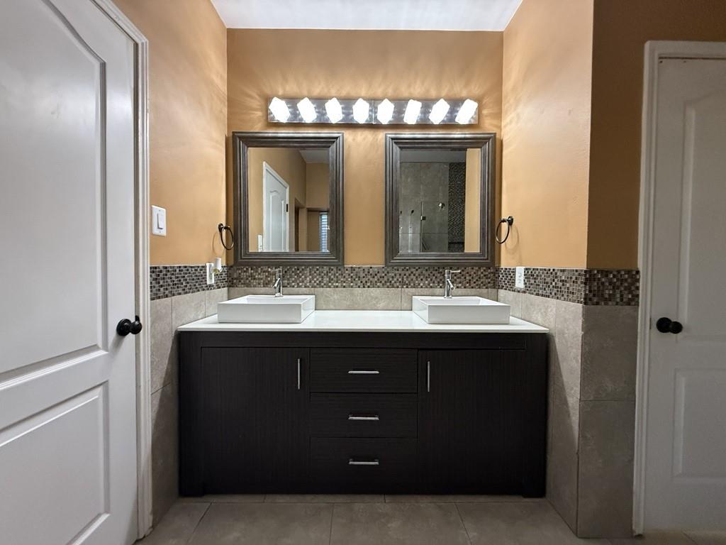 117 Hanover Street Grand Prairie, TX 75052 - Photo 16 of 40 a bathroom with a sink and a mirror