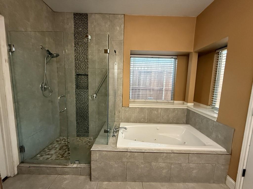 117 Hanover Street Grand Prairie, TX 75052 - Photo 17 of 40 a bath tub sitting next to a bathroom sink