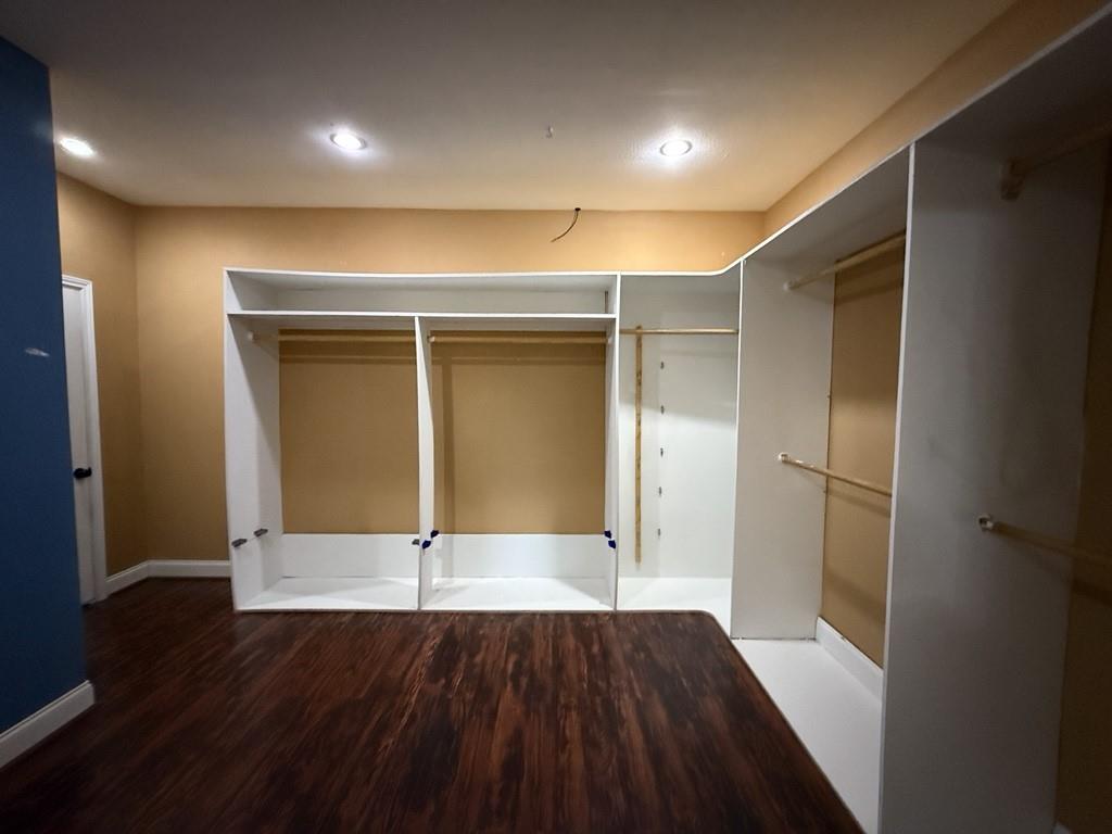 117 Hanover Street Grand Prairie, TX 75052 - Photo 18 of 40 en empty room with wooden floor and window