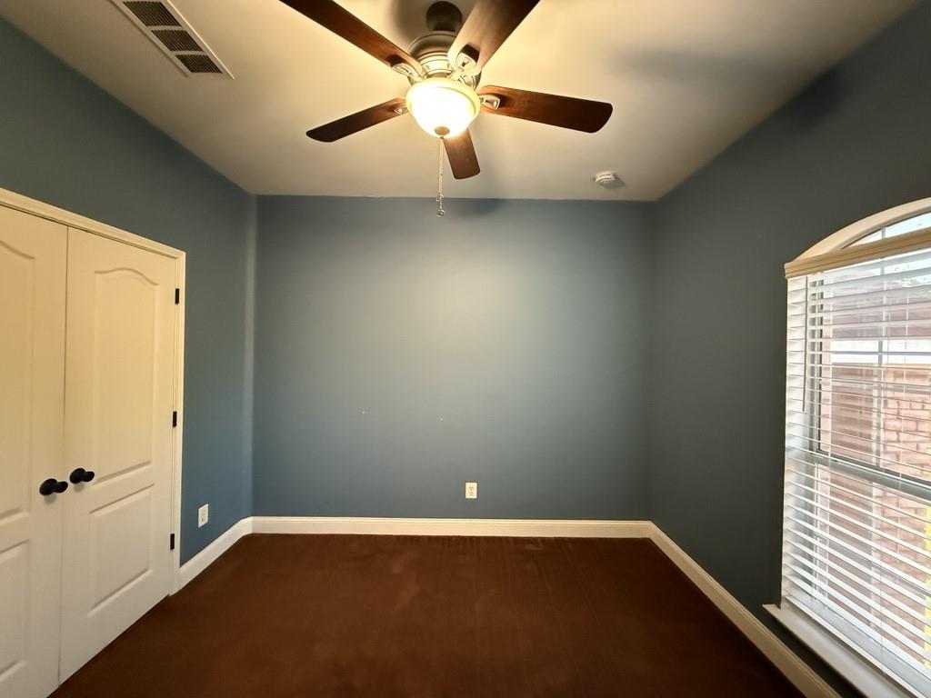 117 Hanover Street Grand Prairie, TX 75052 - Photo 19 of 40 an empty room with a window and a fan