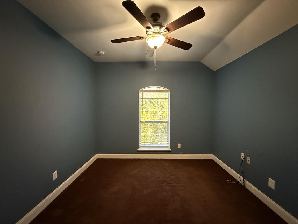 117 Hanover Street Grand Prairie, TX 75052 - Photo 23 of 40 an empty room with a window and a fan