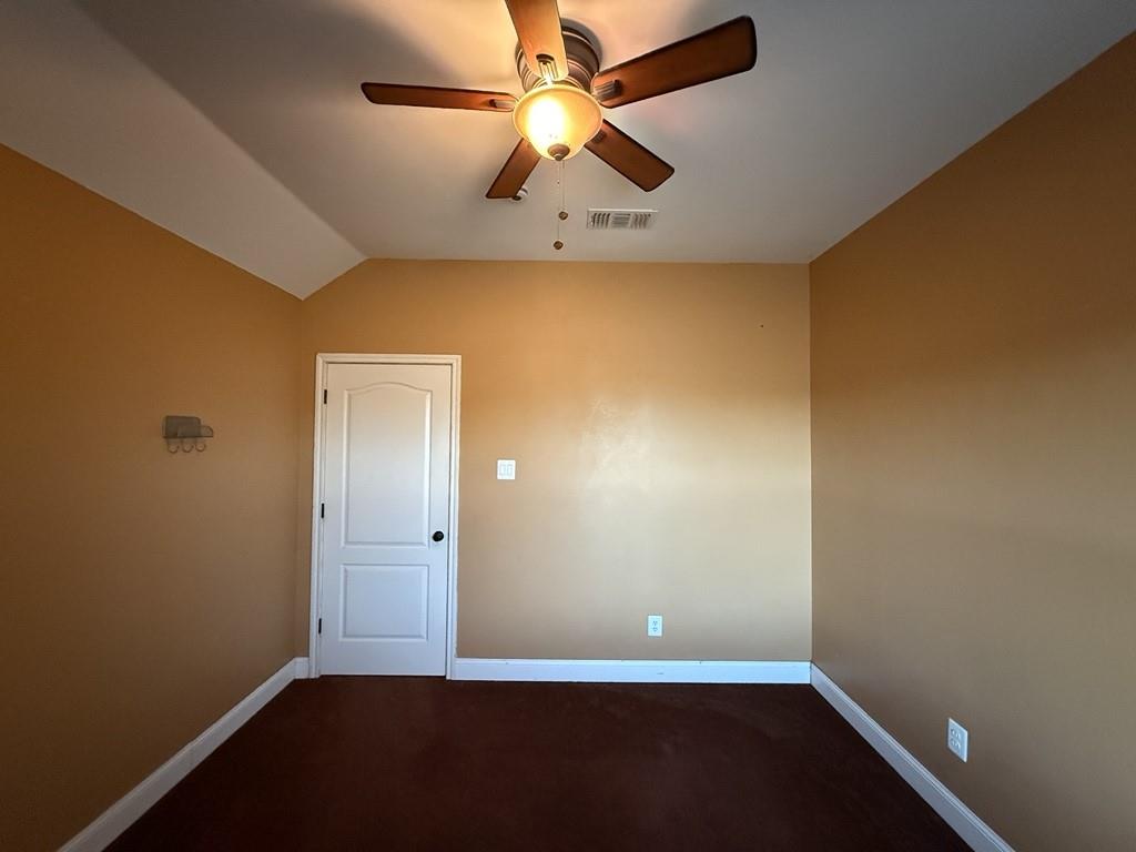 117 Hanover Street Grand Prairie, TX 75052 - Photo 34 of 40 an empty room with a window and a ceiling fan