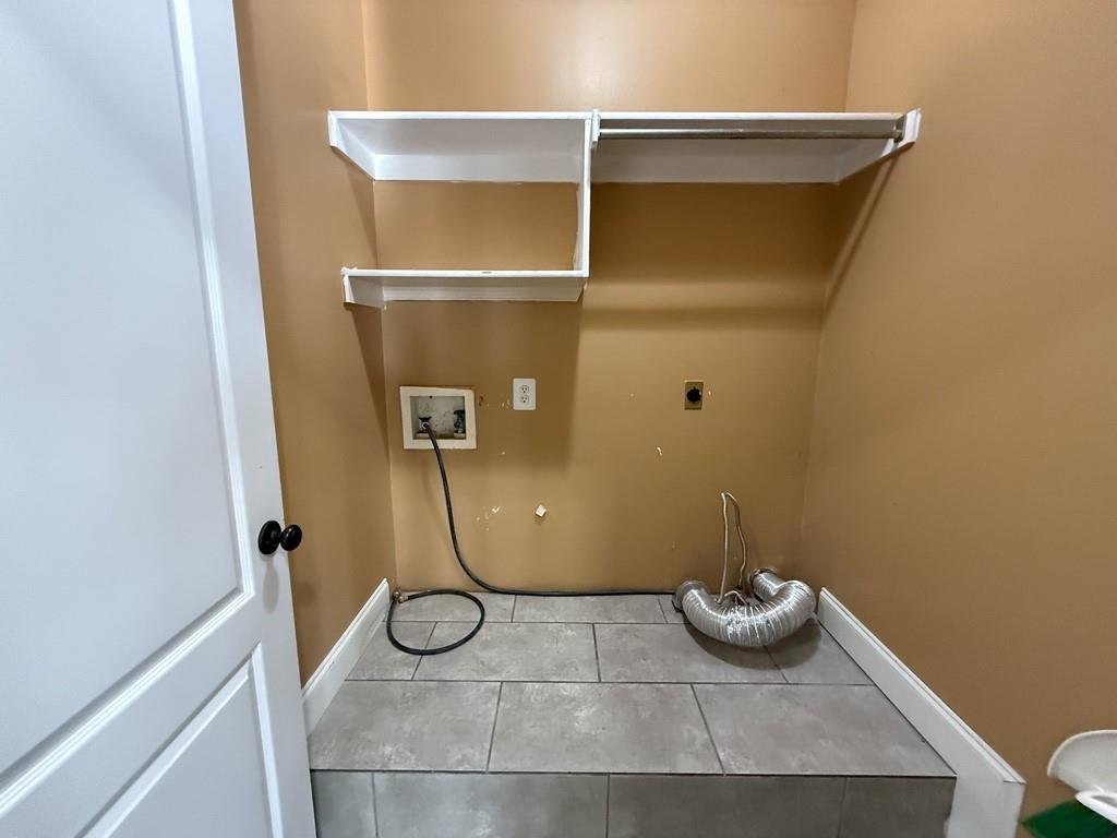 117 Hanover Street Grand Prairie, TX 75052 - Photo 36 of 40 a bathroom with a granite countertop shower and a sink