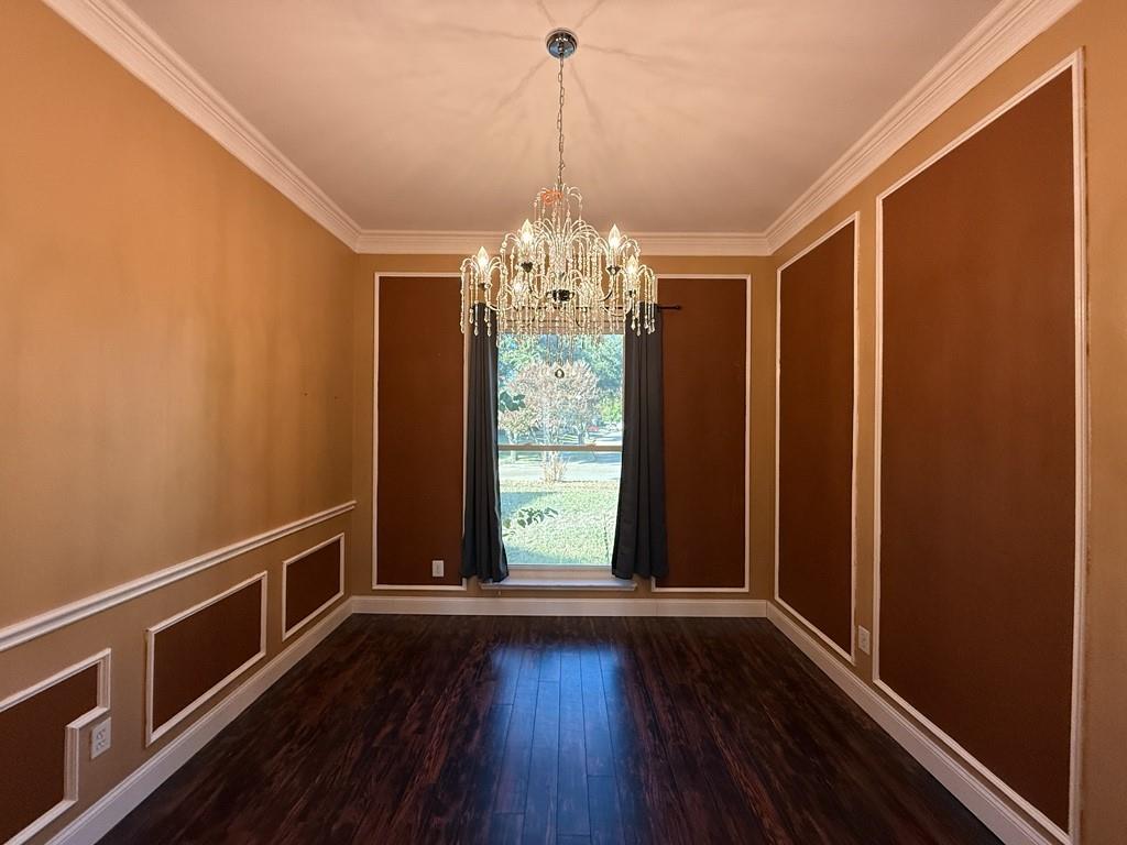 117 Hanover Street Grand Prairie, TX 75052 - Photo 8 of 40 a view of a room with wooden floor and large window