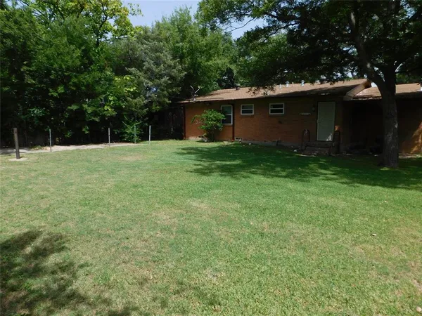 a view of a backyard with a garden