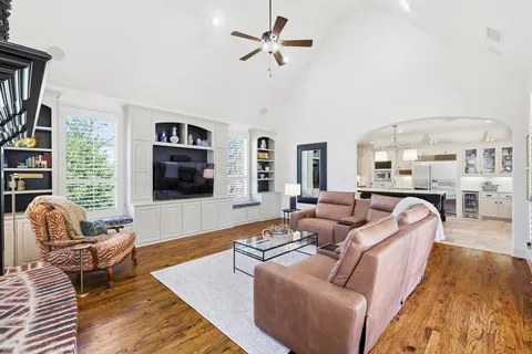 a living room with furniture fireplace and a flat screen tv