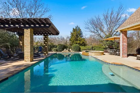 a view of a swimming pool with a patio