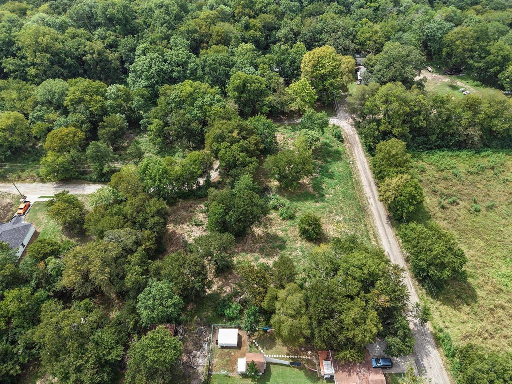 2 Smith Street Bonham, TX 75418 - Photo 11 of 17 an aerial view of residential houses with outdoor space and trees