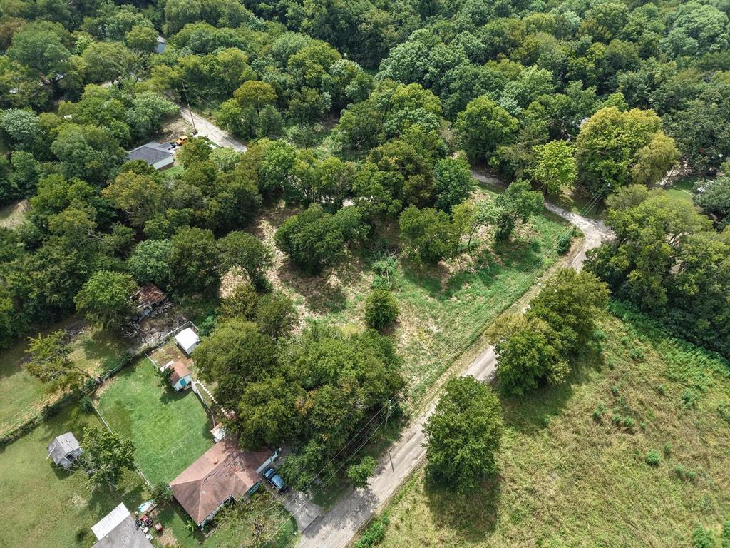 2 Smith Street Bonham, TX 75418 - Photo 13 of 17 an aerial view of residential houses with outdoor space and trees