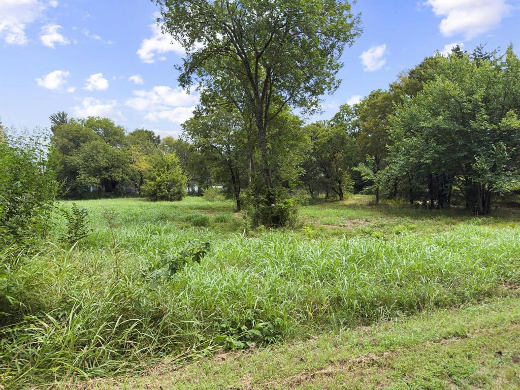 2 Smith Street Bonham, TX 75418 - Photo 15 of 17 a view of outdoor space with deck and yard