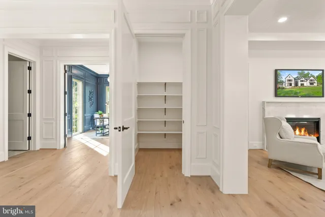 a large kitchen with a table and chairs in it