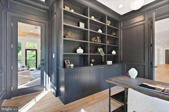 a bedroom with furniture and large window