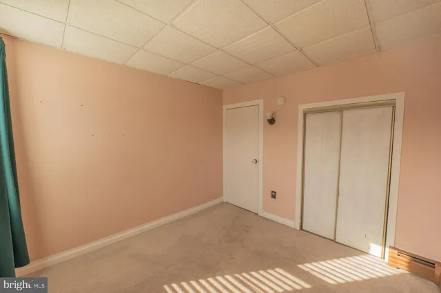 a view of a swimming pool with a patio and yard