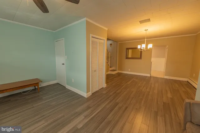 a view of a livingroom with wooden floor