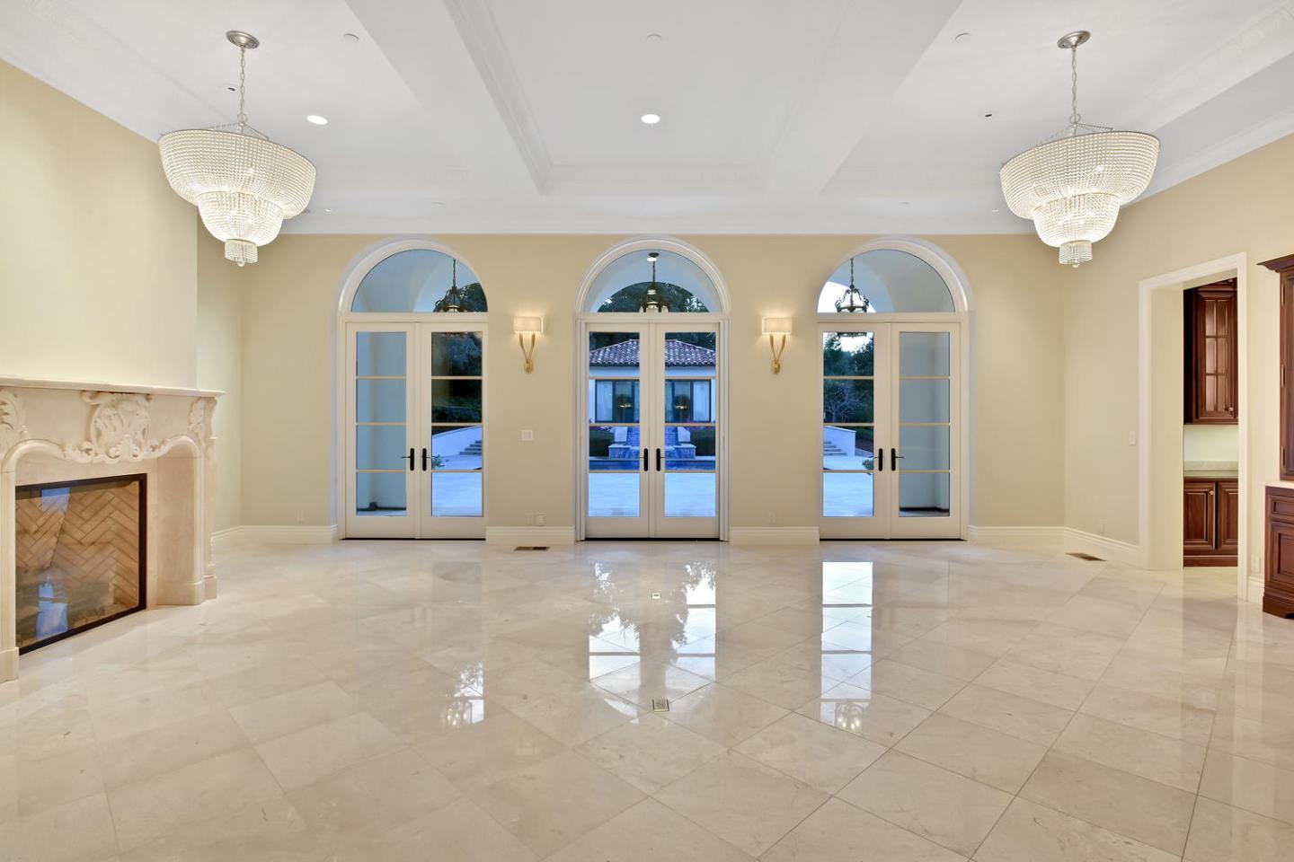 18612 Decatur Road Monte Sereno, CA 95030 - Photo 22 of 50 a view of a room with chandelier fan and large windows