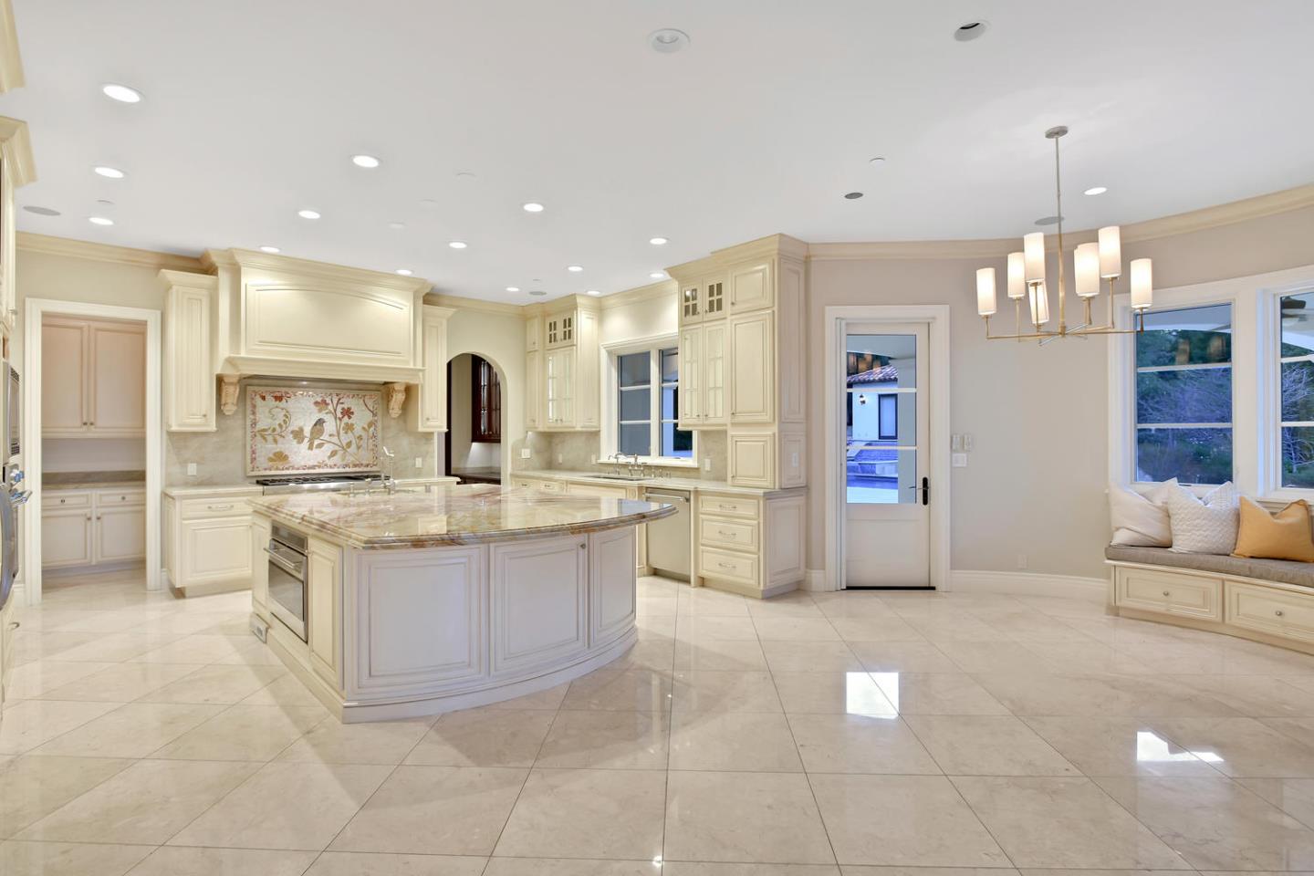 18612 Decatur Road Monte Sereno, CA 95030 - Photo 29 of 50 a large kitchen with kitchen island a large counter top stainless steel appliances and cabinets