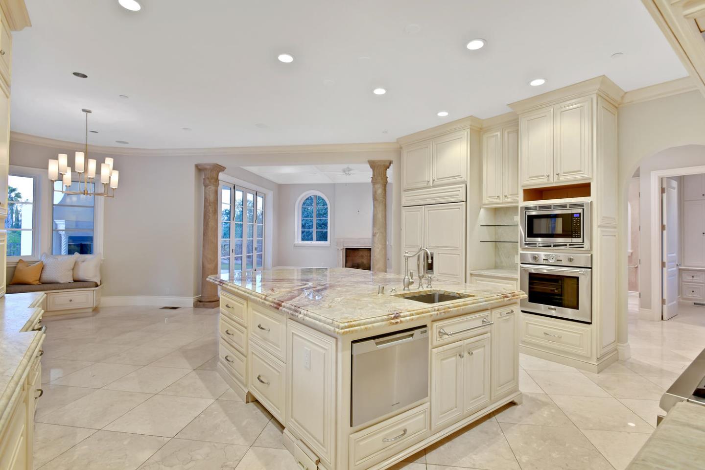 18612 Decatur Road Monte Sereno, CA 95030 - Photo 31 of 50 a kitchen that has a lot of cabinets in it and wooden floors