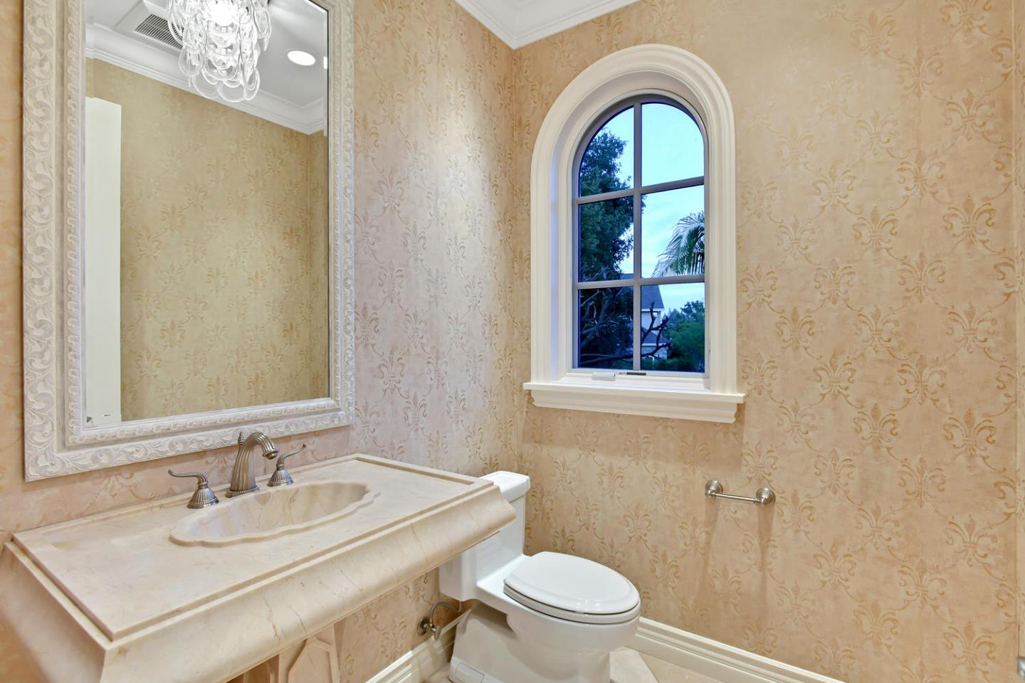 18612 Decatur Road Monte Sereno, CA 95030 - Photo 35 of 50 a bathroom with a sink a toilet and a mirror