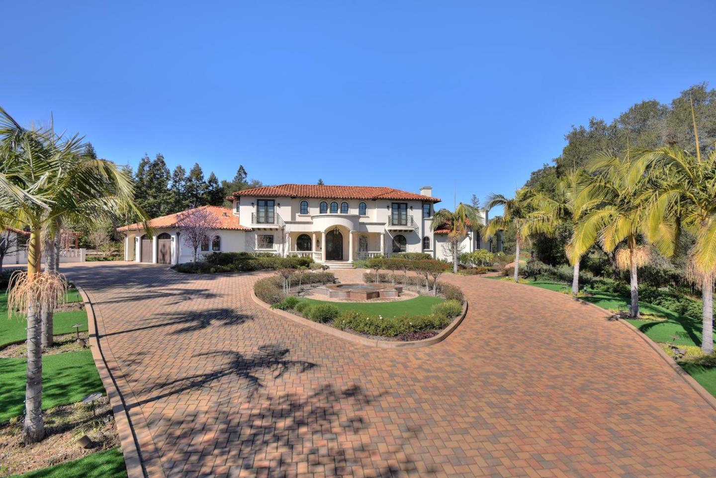 18612 Decatur Road Monte Sereno, CA 95030 - Photo 9 of 50 a patio with a table and chairs under an umbrella