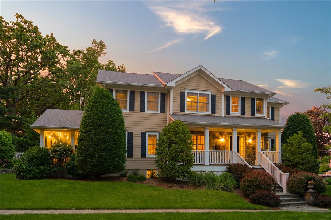 39 Ormond Place Rye, NY 10580 - Photo 1 of 1 a front view of a house with a yard and potted plants