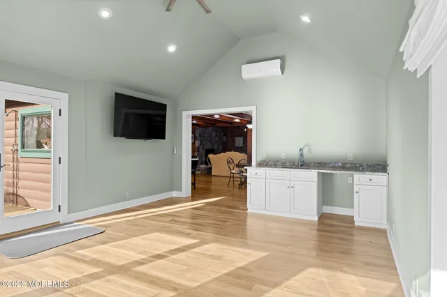 a bedroom with a bed and a chair