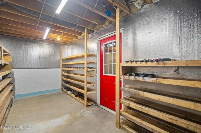 a front view of house with a yard covered with snow