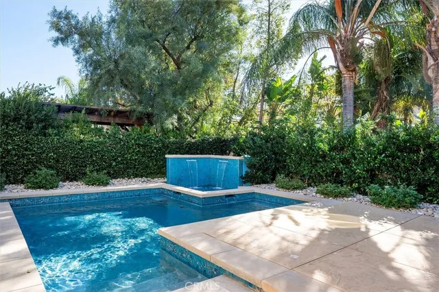 a front view of a house with swimming pool