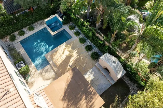 a bathroom with a granite countertop sink and a mirror a toilet