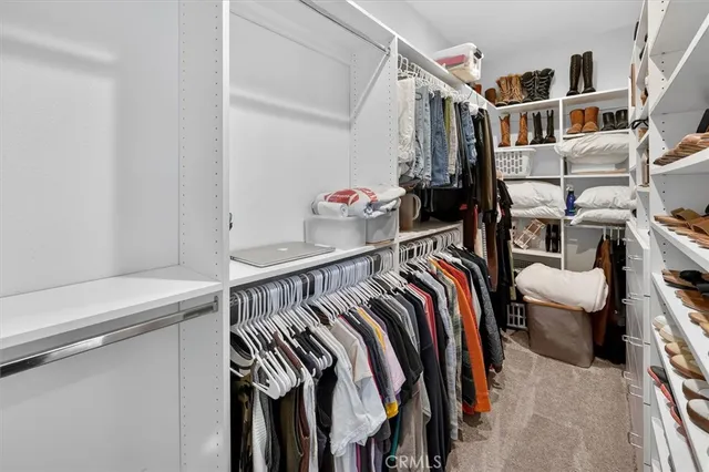 a spacious bathroom with double sink and a mirror