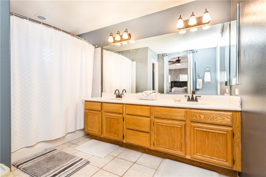 111 Colony Way Aliso Viejo, CA 92656 - Photo 19 of 29 a bathroom with a double vanity sink and a mirror