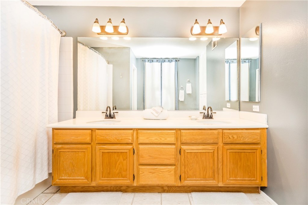 111 Colony Way Aliso Viejo, CA 92656 - Photo 20 of 29 a bathroom with a sink and a mirror