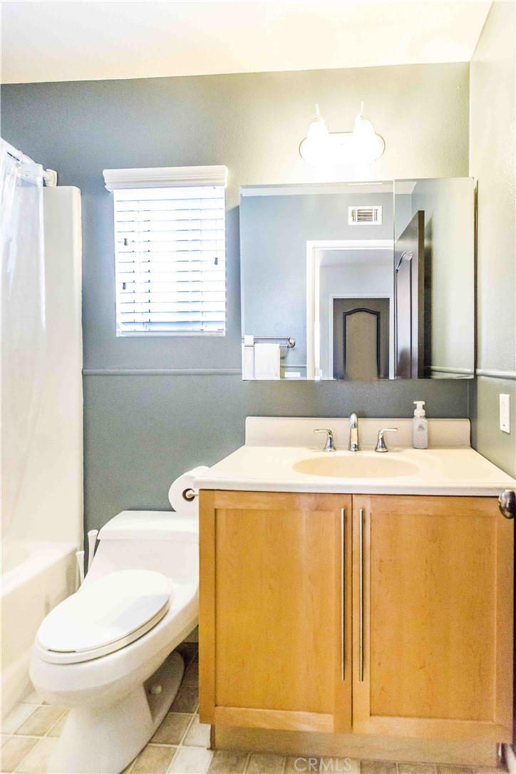 111 Colony Way Aliso Viejo, CA 92656 - Photo 22 of 29 a bathroom with a sink a toilet and mirror