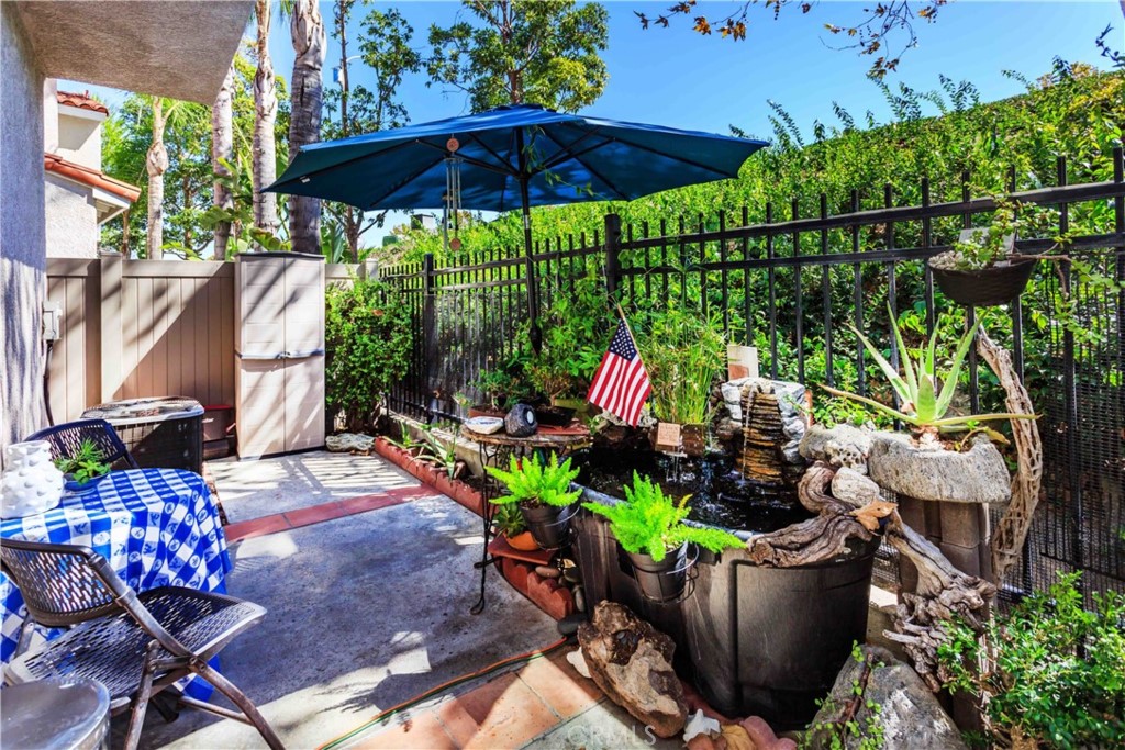 111 Colony Way Aliso Viejo, CA 92656 - Photo 25 of 29 a view of a chair and table in patio with potted plants
