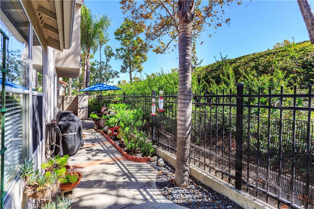 111 Colony Way Aliso Viejo, CA 92656 - Photo 28 of 29 a couple of flower plants in front of a building