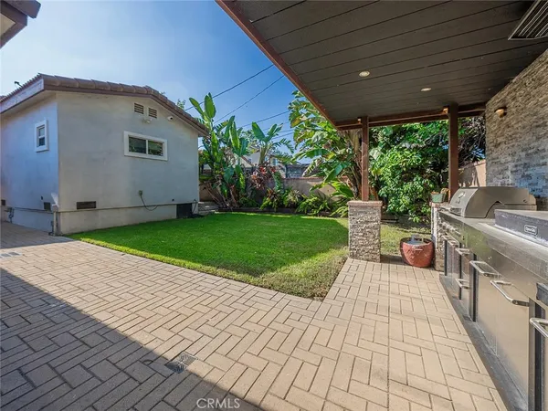 a view of a backyard with sitting area